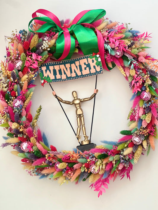 Award winning Rainbow Wreath with the trophy in the middle of it, won from Kirstie’s Handmadr Christmas on Channel 4