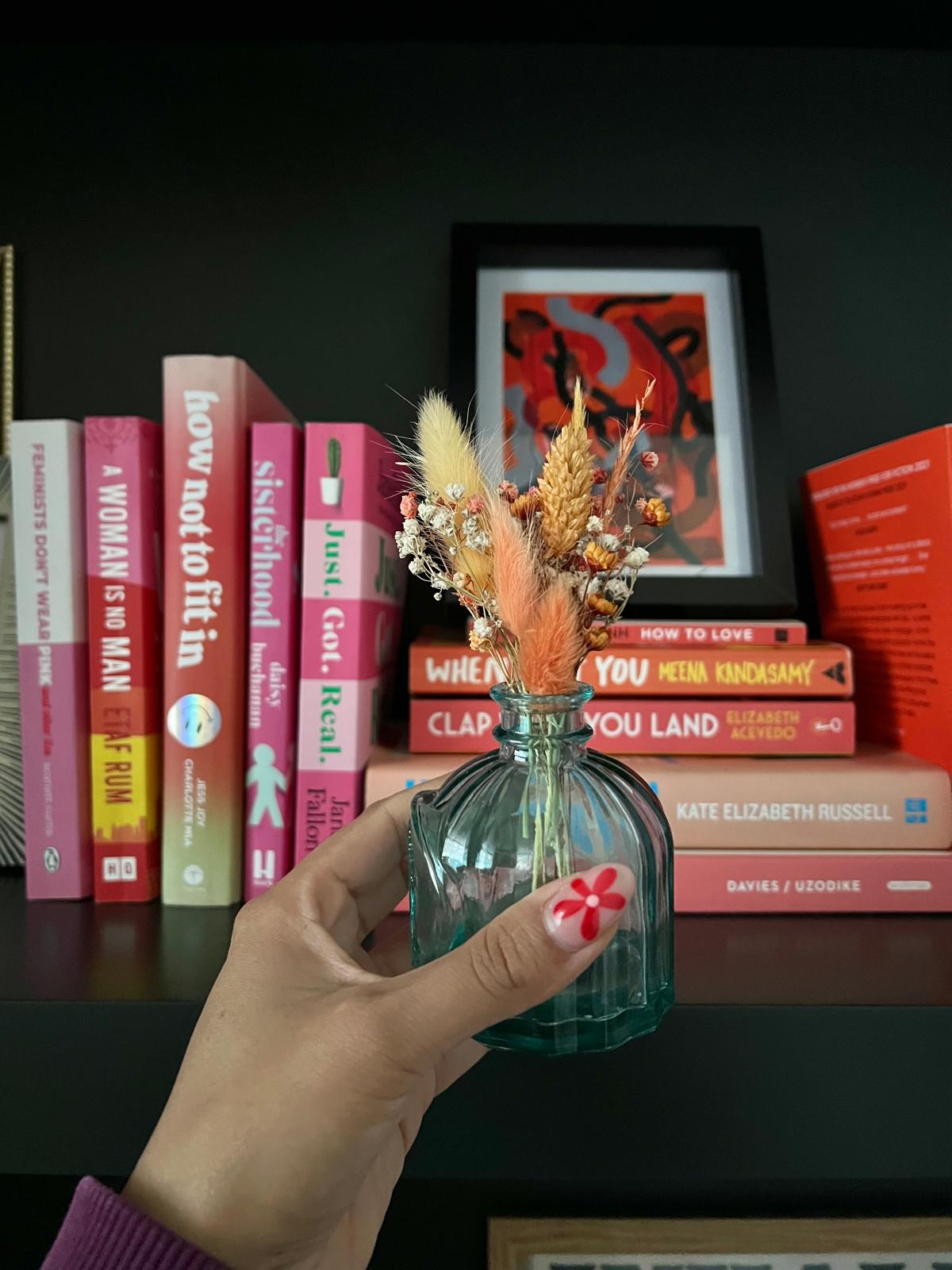 Handmade 'Get Well Soon' card featuring dried flowers arranged in a slot, which can be removed and placed in a small vase. The card is crafted with care, offering a thoughtful and long-lasting gesture of warmth and recovery.