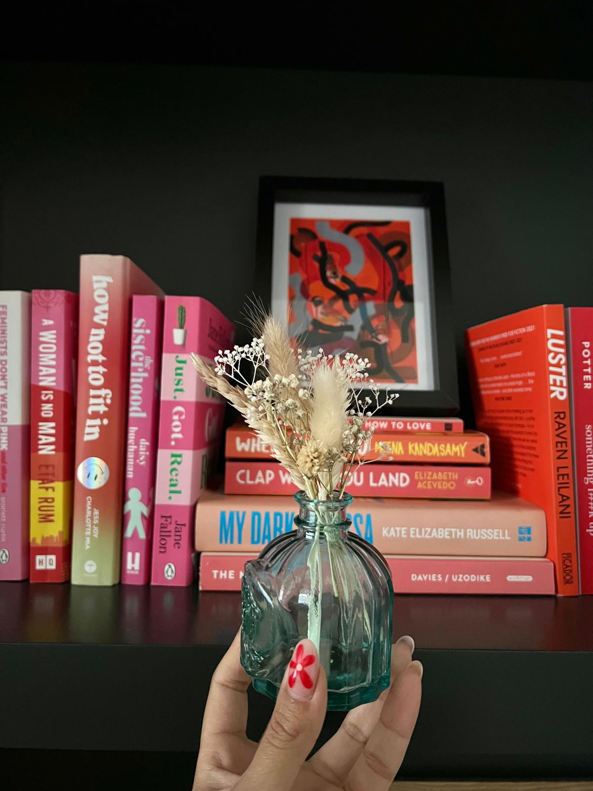 Handmade 'Happy Anniversary' card with dried flowers arranged in a removable slot. The flowers can be taken out and placed in a small vase, creating a lasting keepsake for the special occasion.